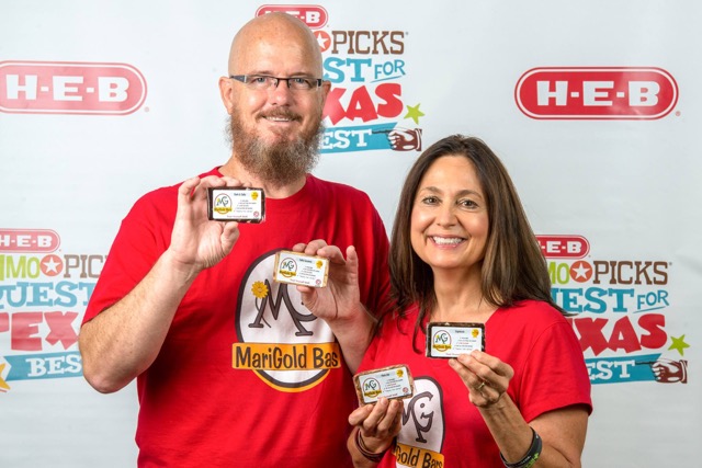 Mari Ann and Steve, owners of MariGold Bars, holding protein bars HEB